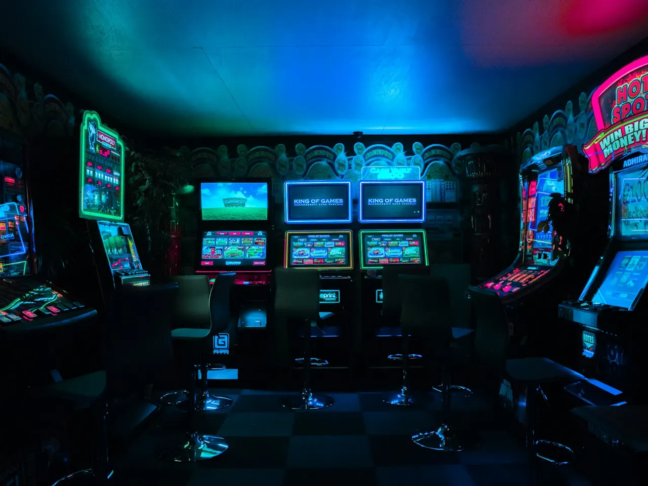 Gaming room lit by arcade machines