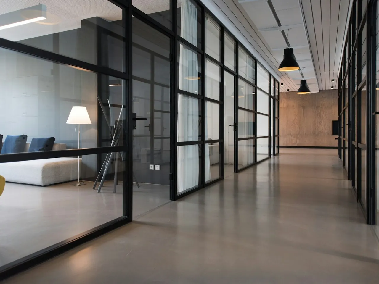 Shared office corridor and glass meeting rooms
