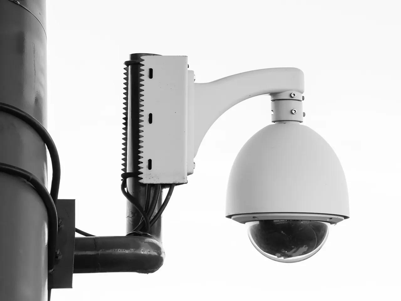 Dome security camera mounted on a post